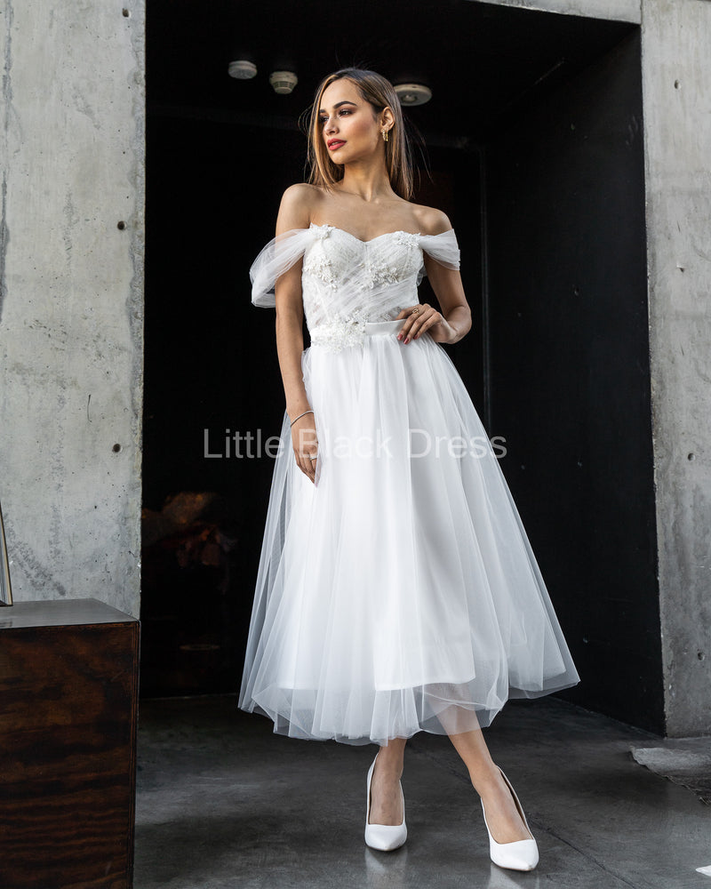 Vestido de novia drapeado con bordado